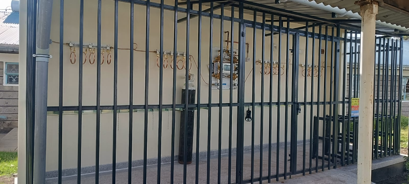 Locked medical gas plant enclosure with manifold and cylinder