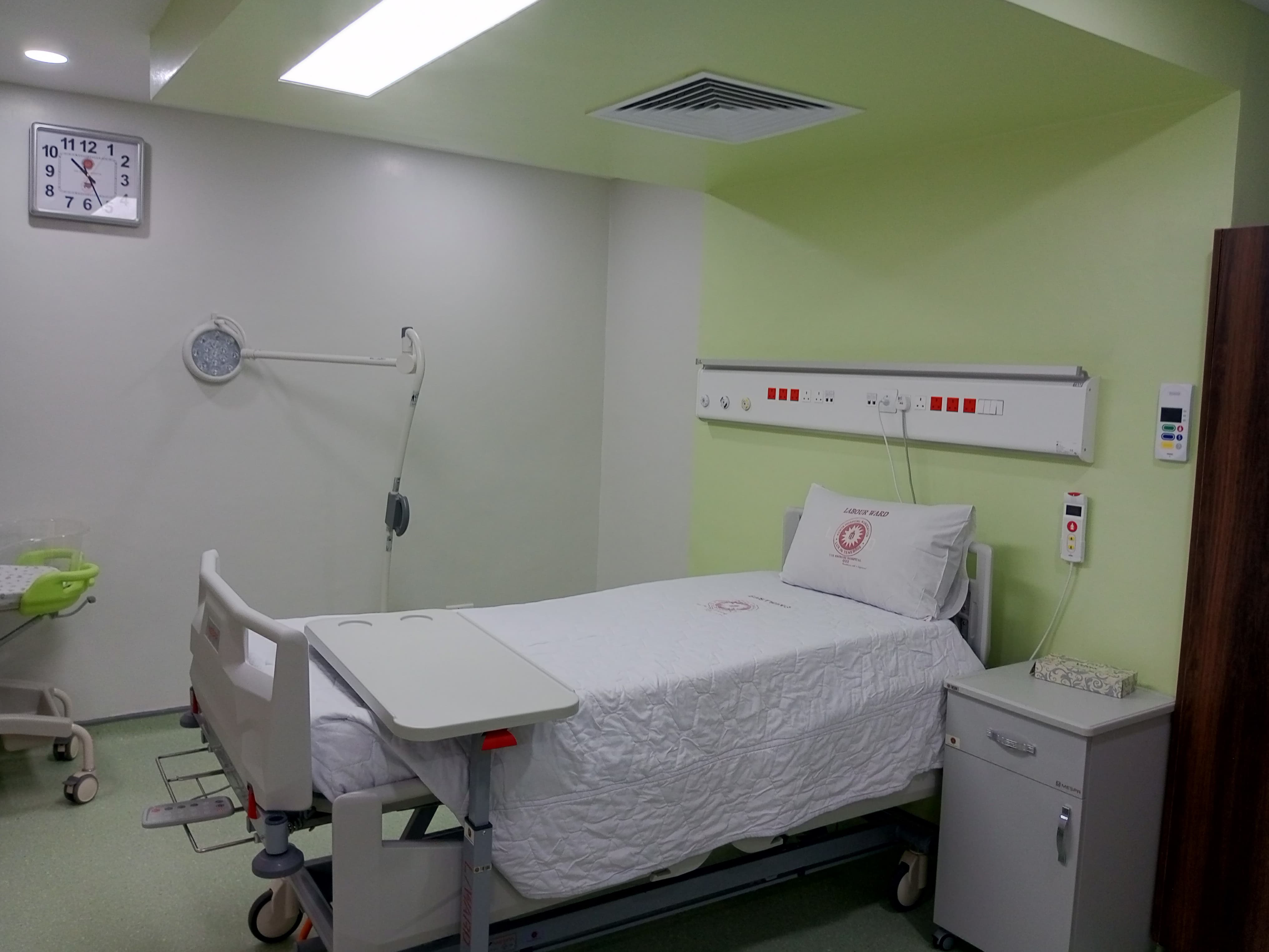 Labour ward room with bed head unit and nurse call at The Nairobi Hospital