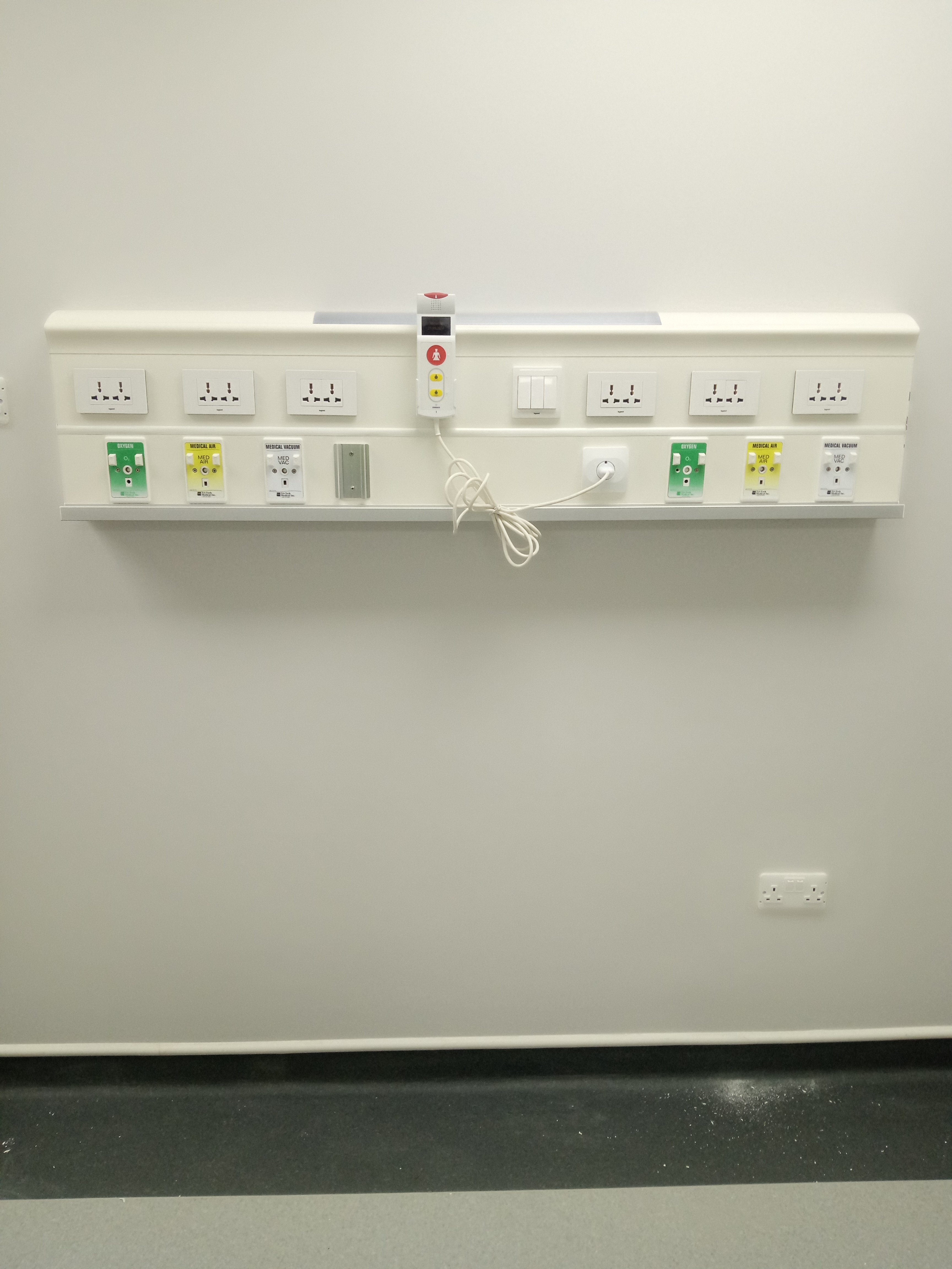Bed head trunking with medical gas outlets and nurse call handset